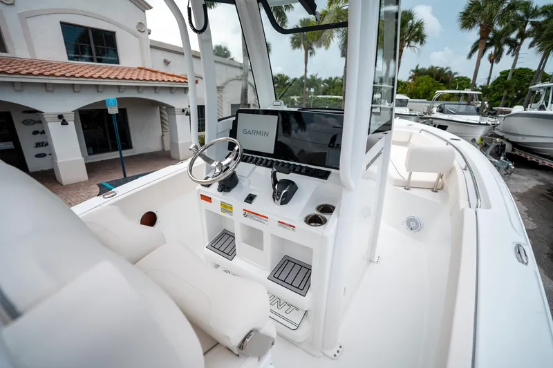 Slide: The Image of Interior view of 2025 Sea Hunt Ultra 239 SE boat with Garmin navigation system. - 11