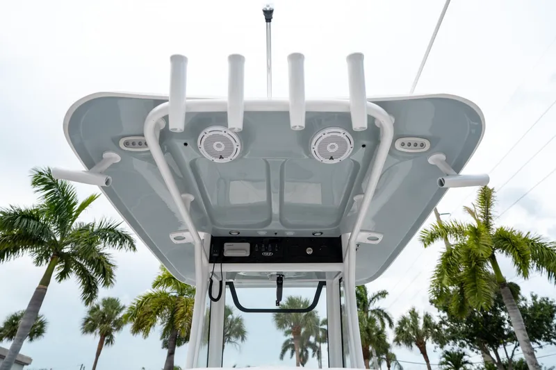 Slide: The Image of 2025 Sea Hunt Ultra 239 SE boat top view with rod holders and speakers. - 25