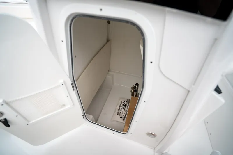 Slide: The Image of Storage compartment inside 2025 Sea Hunt Ultra 239 SE boat. - 35