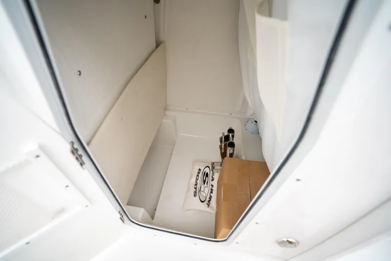 Slide: The Image of Interior storage compartment of 2025 Sea Hunt Ultra 239 SE boat. - 36