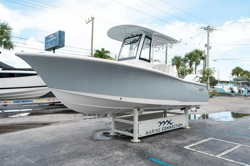 Slide: The Image of 2025 Sea Hunt Ultra 239 SE boat displayed at Marine Connection dealership. - 6