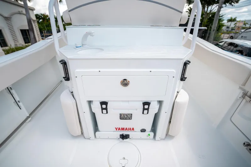 Slide: The Image of 2025 Sea Hunt Ultra 239 SE boat interior with Yamaha cooler and sink. - 15