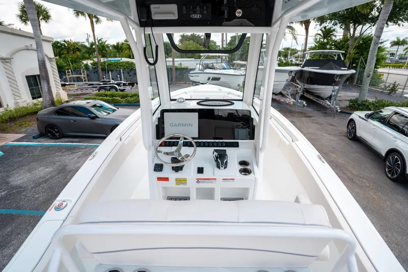 Slide: The Image of 2025 Sea Hunt Ultra 239 SE boat dashboard with Garmin navigation system. - 20