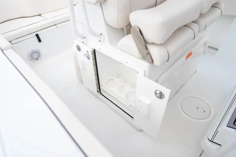Slide: The Image of 2025 Sea Hunt Ultra 239 SE boat interior with open storage compartment and seating. - 33