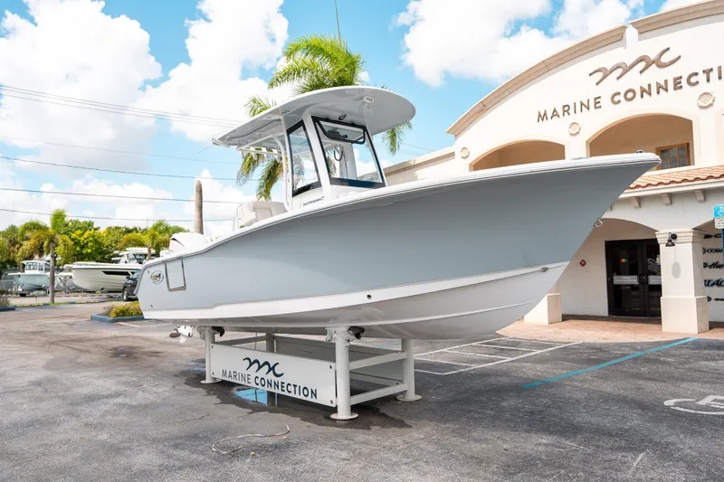 Slide: The Image of 2025 Sea Hunt Ultra 239 SE boat displayed at Marine Connection dealership. - 8