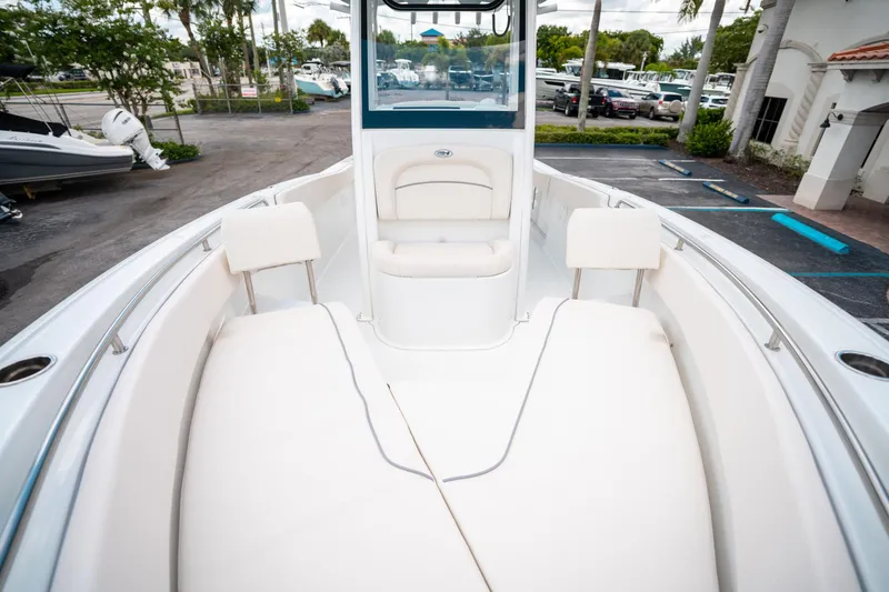 Slide: The Image of 2025 Sea Hunt Ultra 239 SE boat interior with cushioned seating and sleek design. - 39