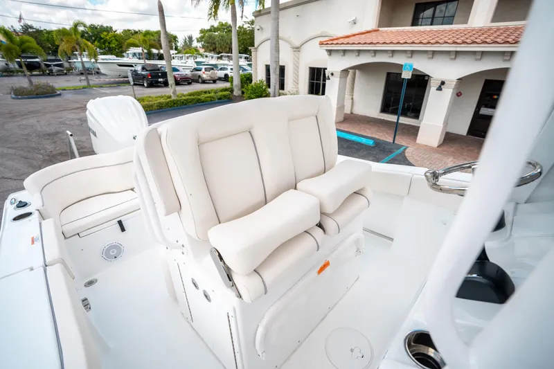 Slide: The Image of 2025 Sea Hunt Ultra 239 SE boat interior with plush seating and modern design. - 28