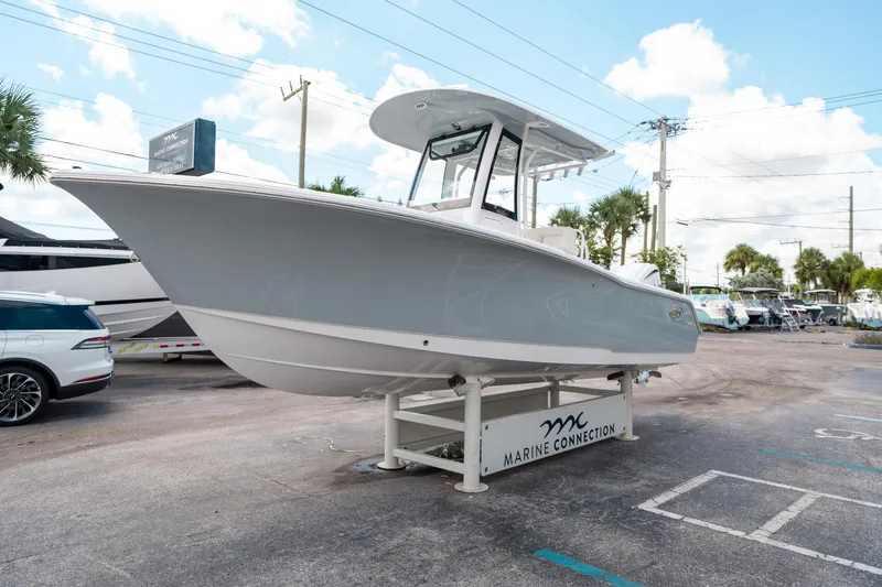 Slide: The Image of 2025 Sea Hunt Ultra 239 SE boat displayed at Marine Connection dealership. - 6