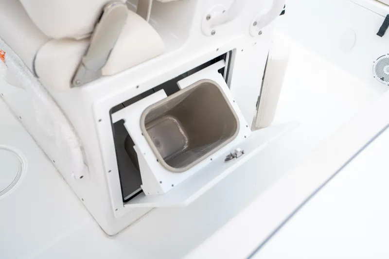 Slide: The Image of 2025 Sea Hunt Ultra 239 SE boat storage compartment open. - 32