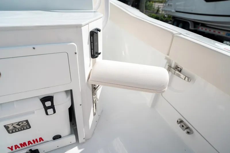 Slide: The Image of Interior of 2025 Sea Hunt Ultra 239 SE boat with Yamaha cooler and foldable seat. - 19