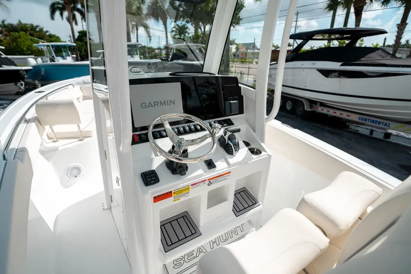 Slide: The Image of 2025 Sea Hunt Ultra 239 SE boat console with Garmin navigation system. - 26