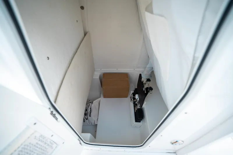 Slide: The Image of Interior storage compartment of 2025 Sea Hunt Ultra 239 SE boat. - 32