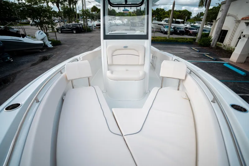 Slide: The Image of 2025 Sea Hunt Ultra 239 SE boat interior with white seating and sleek design. - 37
