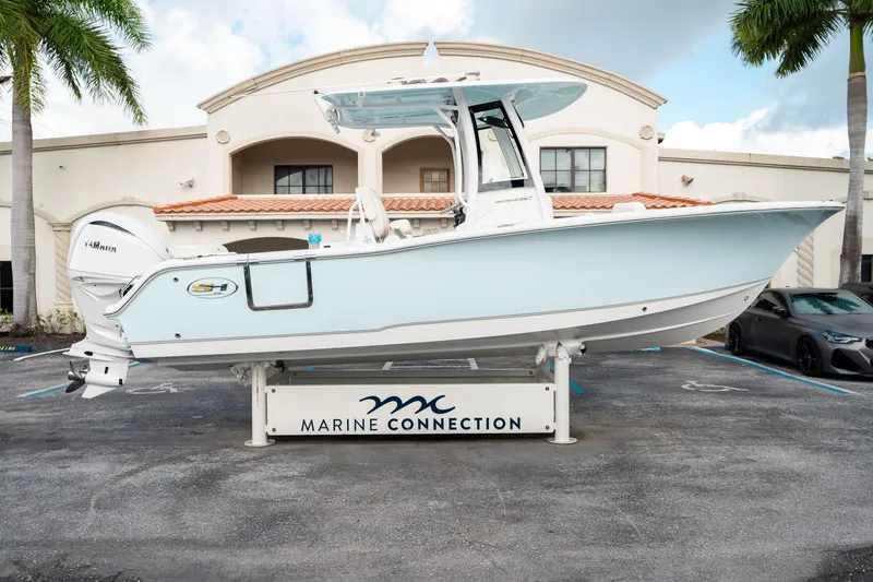 Slide: The Image of 2025 Sea Hunt Ultra 239 SE boat displayed at Marine Connection dealership. - 1