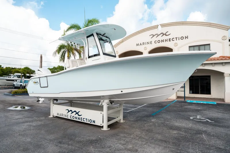 Slide: The Image of 2025 Sea Hunt Ultra 239 SE boat displayed at Marine Connection dealership. - 8