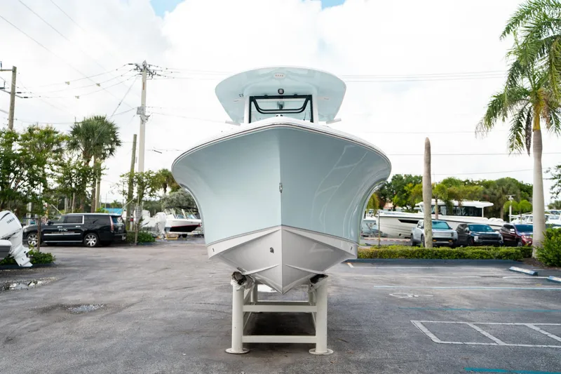Slide: The Image of 2025 Sea Hunt Ultra 239 SE boat displayed outdoors, front view. - 7