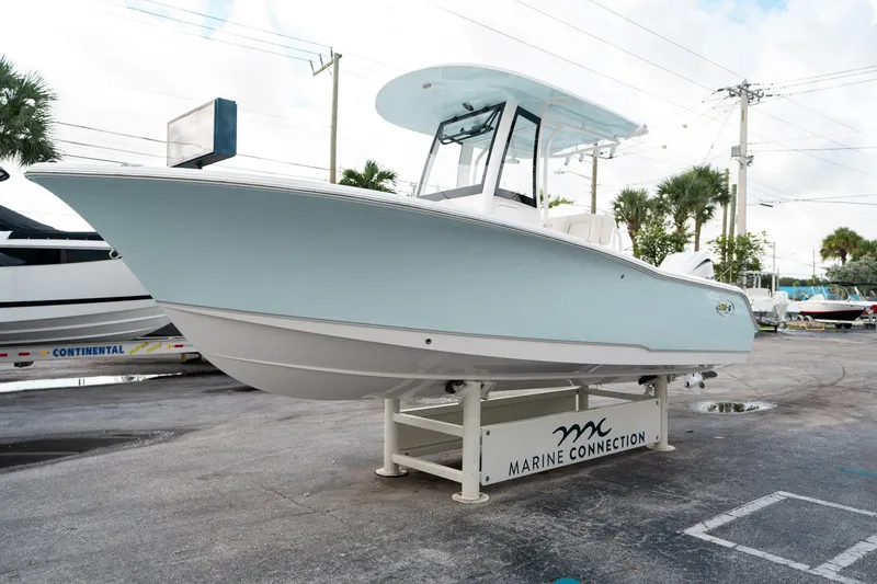 Slide: The Image of 2025 Sea Hunt Ultra 239 SE boat displayed at Marine Connection dealership. - 6
