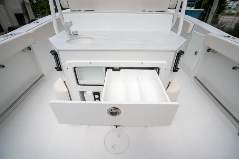Slide: The Image of 2025 Sea Hunt Ultra 275 SE boat interior with open storage compartments. - 20