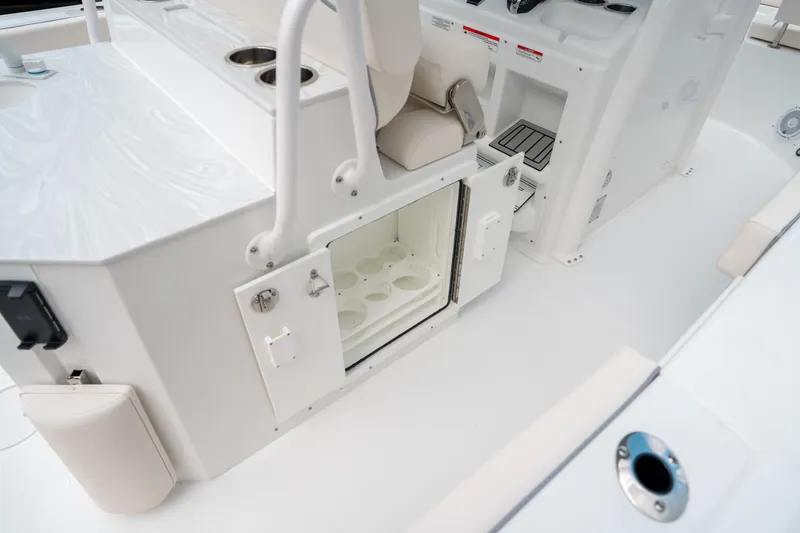 Slide: The Image of 2025 Sea Hunt Ultra 275 SE boat interior with open storage compartment. - 25