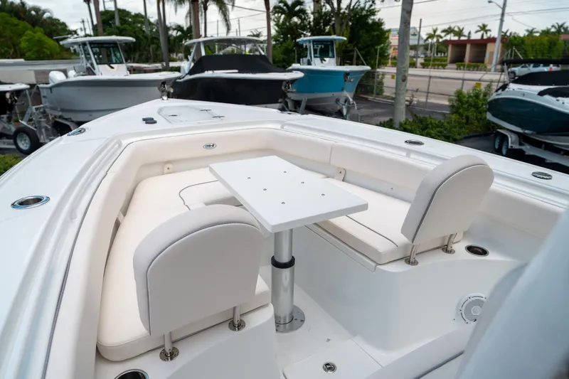 Slide: The Image of 2025 Sea Hunt Ultra 275 SE boat interior with seating and table. - 42