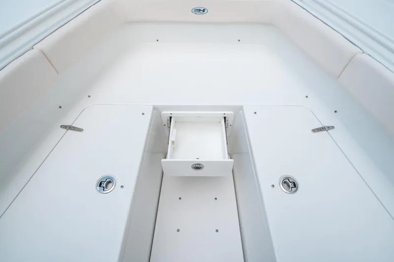 Slide: The Image of 2025 Sea Hunt Ultra 275 SE boat interior with storage compartment. - 48
