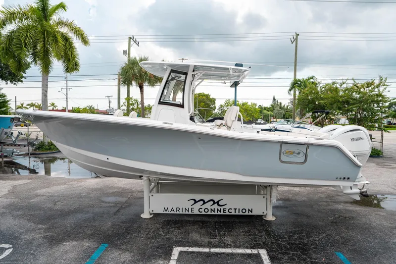 Slide: The Image of 2025 Sea Hunt Ultra 275 SE boat displayed at Marine Connection dealership. - 5