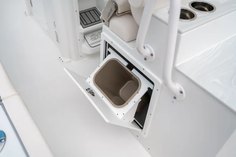Slide: The Image of 2025 Sea Hunt Ultra 275 SE boat interior with open storage compartment. - 24