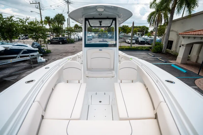 Slide: The Image of 2025 Sea Hunt Ultra 275 SE boat interior with white seating and modern design. - 39