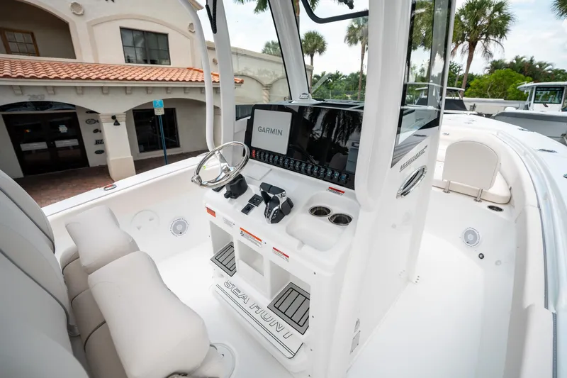 Slide: The Image of 2025 Sea Hunt Ultra 275 SE boat interior with Garmin navigation system and sleek design. - 28