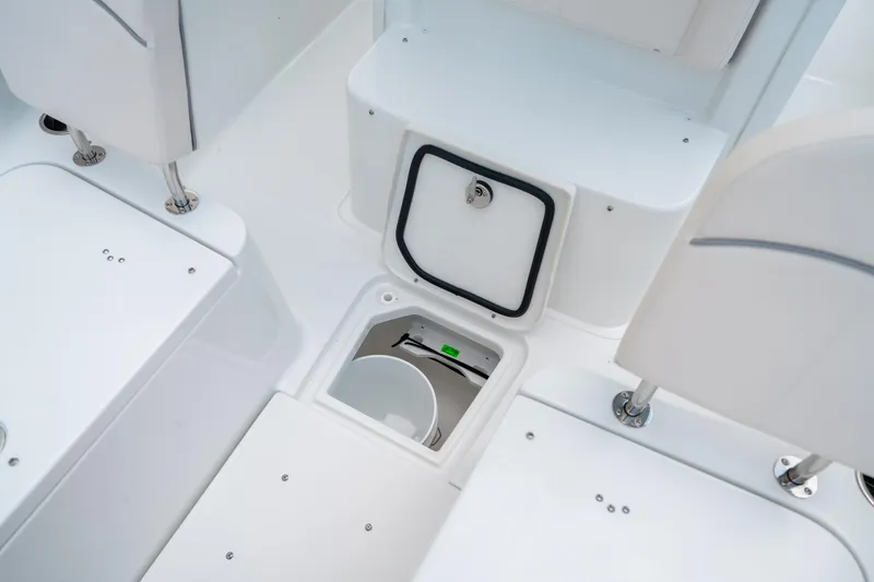 Slide: The Image of 2025 Sea Hunt Ultra 275 SE boat interior with open storage compartment. - 47
