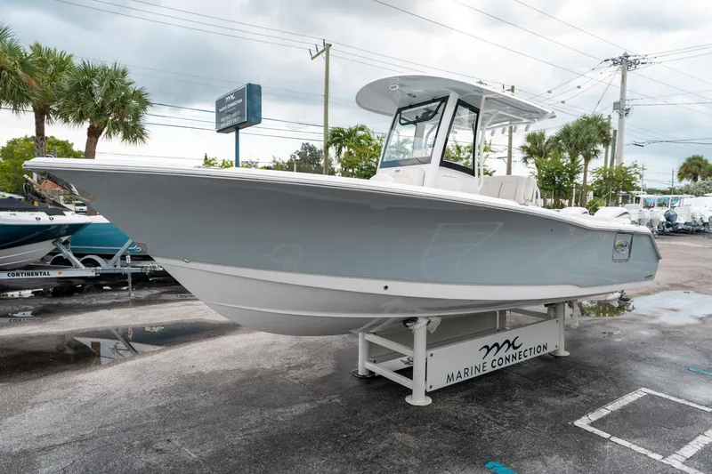 Slide: The Image of 2025 Sea Hunt Ultra 275 SE boat displayed at Marine Connection dealership. - 6