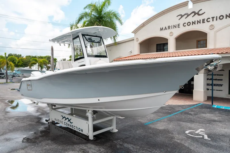 Slide: The Image of 2025 Sea Hunt Ultra 275 SE boat displayed at Marine Connection dealership. - 8