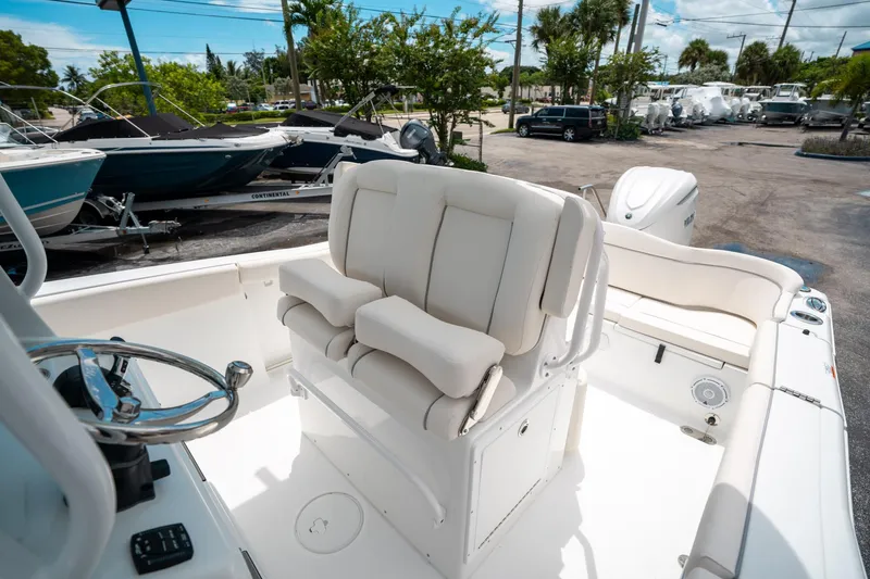 Slide: The Image of 2025 Sea Hunt Ultra 255 SE boat interior with helm and seating area. - 28