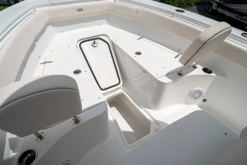 Slide: The Image of 2025 Sea Hunt Ultra 255 SE boat interior with seating and storage compartments. - 44
