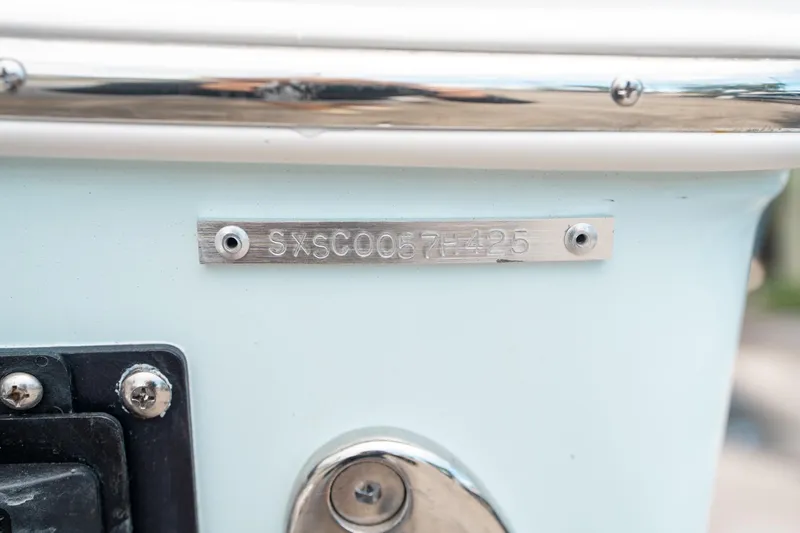 Slide: The Image of Serial number plate on a 2025 Sea Hunt Ultra 255 SE boat. - 48
