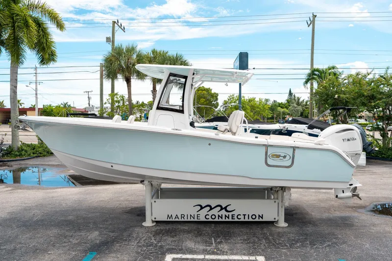 Slide: The Image of 2025 Sea Hunt Ultra 255 SE boat displayed at Marine Connection dealership. - 5