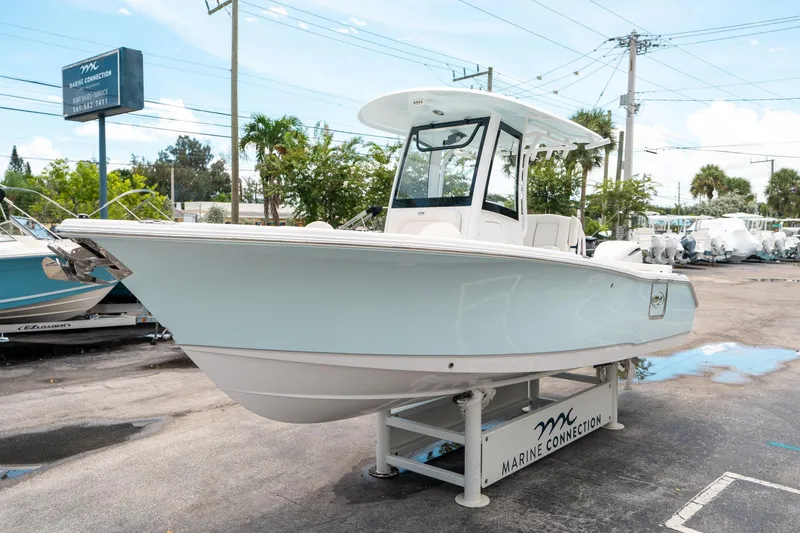 Slide: The Image of 2025 Sea Hunt Ultra 255 SE boat displayed at Marine Connection dealership. - 6