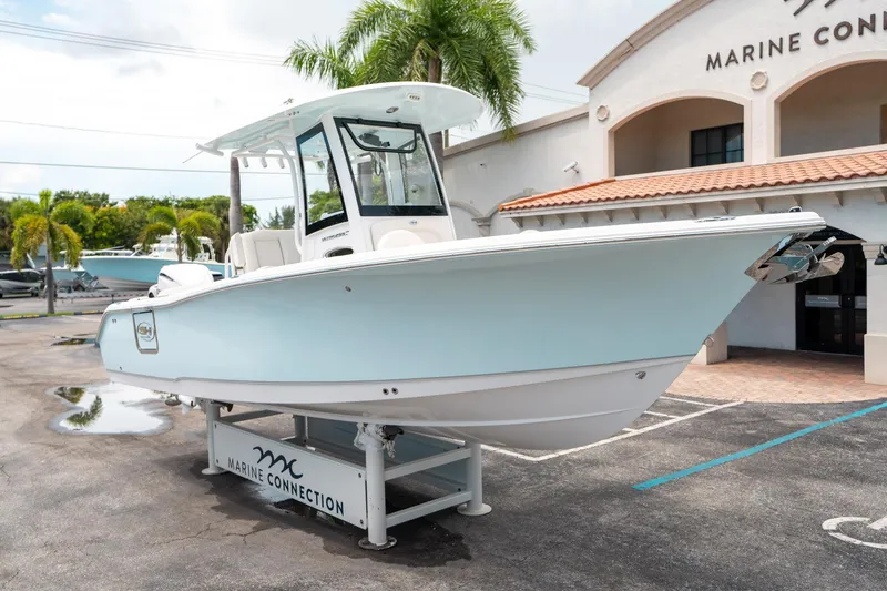 Slide: The Image of 2025 Sea Hunt Ultra 255 SE boat displayed at Marine Connection dealership. - 8