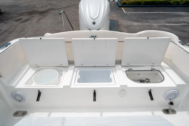 Slide: The Image of 2025 Sea Hunt Ultra 255 SE boat storage compartments and amenities. - 14