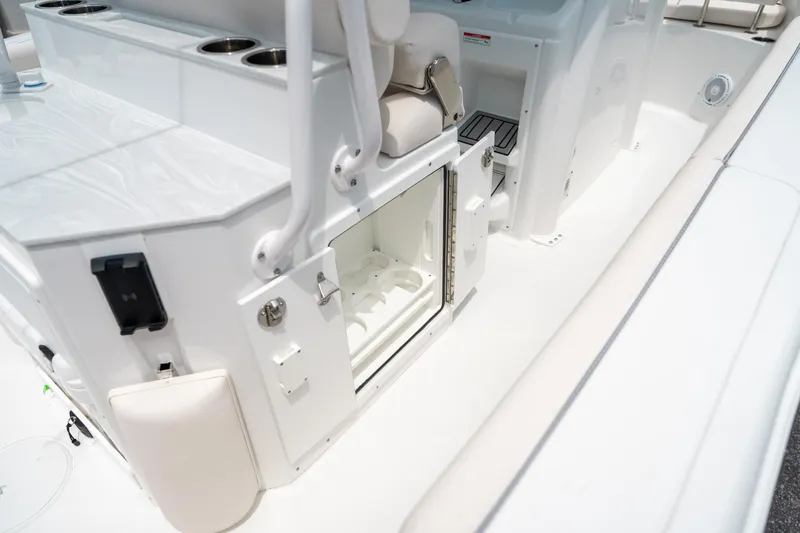 Slide: The Image of 2025 Sea Hunt Ultra 255 SE boat interior with open storage compartment. - 20