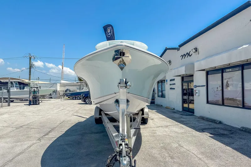 Slide: The Image of 2025 Sea Hunt Ultra 305 SE boat interior with Garmin displays and seating area. - 3