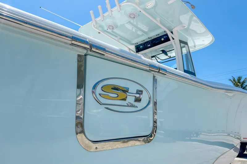 Slide: The Image of 2025 Sea Hunt Ultra 305 SE boat interior with white seating and modern design. - 5