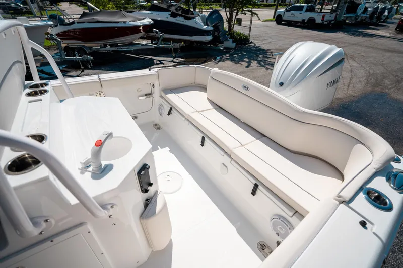 Slide: The Image of 2025 Sea Hunt Ultra 255 SE boat interior with seating and Yamaha engine. - 11