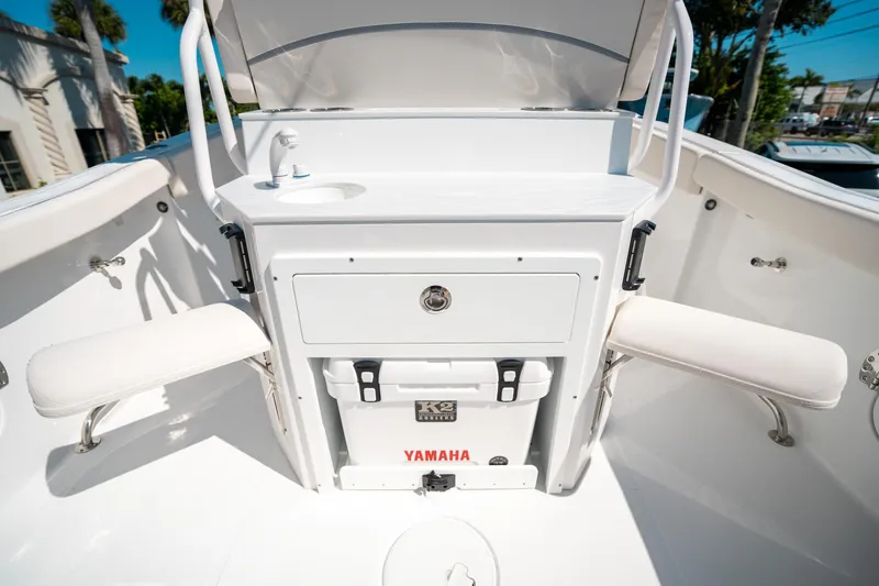 Slide: The Image of 2025 Sea Hunt Ultra 255 SE boat interior with seating and storage. - 16