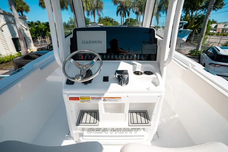 Slide: The Image of 2025 Sea Hunt Ultra 255 SE boat dashboard with Garmin navigation system. - 24
