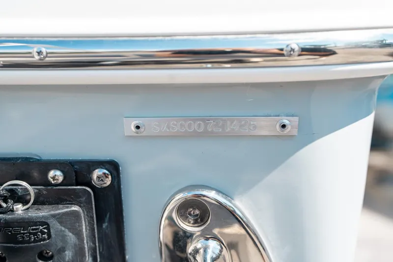 Slide: The Image of 2025 Sea Hunt Ultra 255 SE boat hull identification number plate. - 44