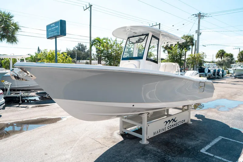 Slide: The Image of 2025 Sea Hunt Ultra 255 SE boat displayed at Marine Connection dealership. - 6