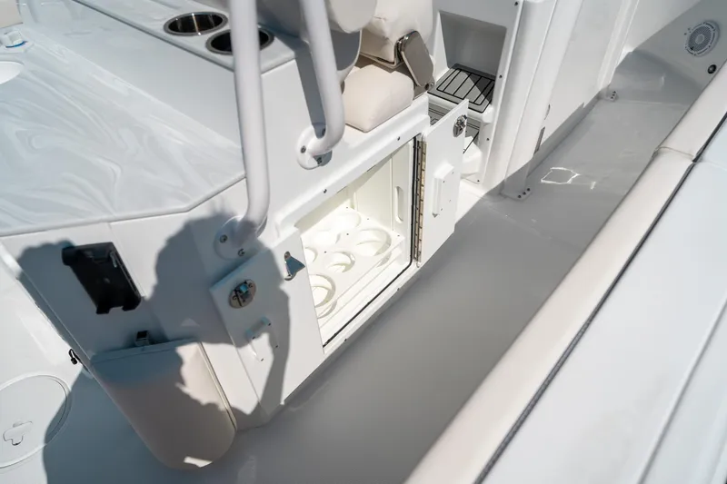 Slide: The Image of 2025 Sea Hunt Ultra 255 SE boat interior with open storage compartment. - 20