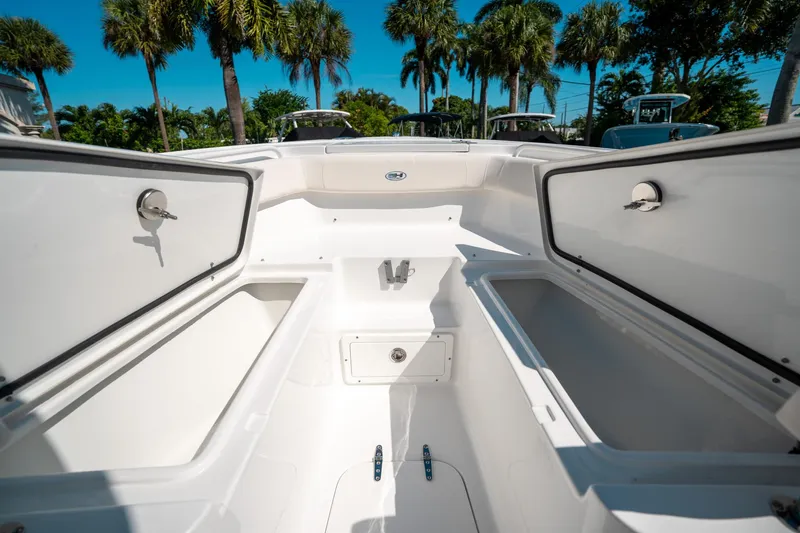 Slide: The Image of 2025 Sea Hunt Ultra 255 SE boat interior with open storage compartments. - 39