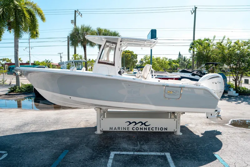 Slide: The Image of 2025 Sea Hunt Ultra 255 SE boat displayed at Marine Connection dealership. - 5
